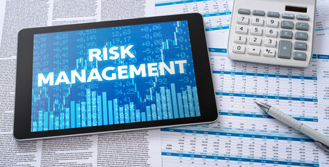 Wall Mural - a tablet with financial documents - risk management