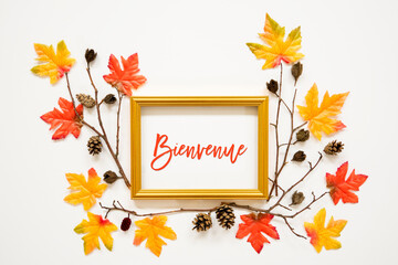 Wall Mural - Golden Frame With French Text Bienvenue Means Welcome. Beautiful, Colorful Autumn Leaf Decoration With Maple Leaf And Fir Cone. White Background