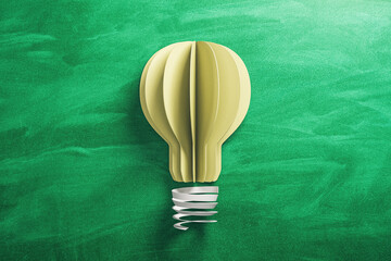 Wall Mural - Yellow light bulb made from paper on blackboard background.