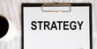 © Veranika - The inscription on a piece of paper is fixed on a tablet for the letter STRATEGY.