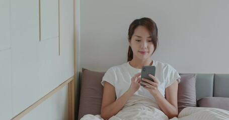 Poster - Woman use of cellphone on bed