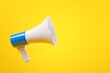 Black and white megaphone over yellow background.