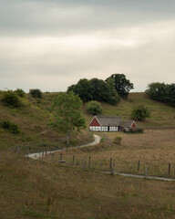 Wall Mural - An old half-timbered house at the end of a winding gravel road in the rural area of Österlen, Sweden