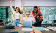 © BullRun - Happy multiethnic coworkers celebrating project finishing
