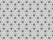 A Tile Able Seamless Christmas Pattern Featuring Snowflakes Of Various Shapes And Designs