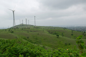 WIND MILL TURBINES ON GREEN HILL 