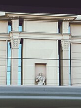 Low Angle View Of Statue Against Historic Building