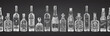 Seamless pattern with hand drawn sketch glasses bottle on chalckboard background Alcoholic drinks Wine, champagne, beer, rum, vodka, tequila Vintage design for bar, restaurant, cafe menu Vector art
