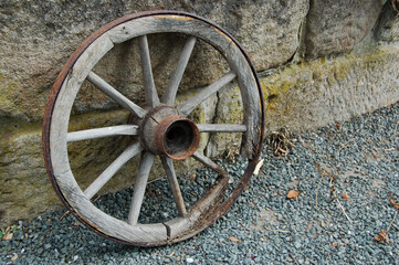 Sticker - Old wooden cart wheel on gravel