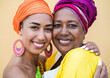 Portrait of happy african mother and daughter - Family, mother and adult child love - Women with traditional dress