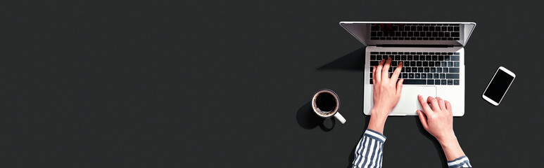 Wall Mural - person using a laptop computer from above