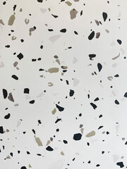 Seamless terrazzo pattern. White background with black, grey and sage color pattern