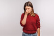 © khosrork - Depression. Portrait of upset girl touching nose and frowning, wiping tears crying, feeling desperate hopeless, coping lonely in emotional stress. indoor studio shot isolated on gray background