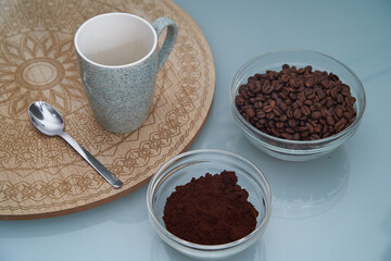 Poster - Closeup shot of aromatic coffee beans, melted coffee, cup and spoon