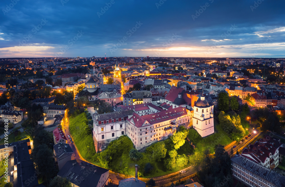 Lublin, Poland. Aerial view of Old Town at dusk with historic Dominican Abbey on foreground - obrazy, fototapety, plakaty 