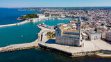 Fototapeta Krajobraz - Aerial view of Trani in the southeastern region of Apulia in Italy - Entrance to the old port of Trani from above with the Cathedral of San Nicola Pellegrino on the coast of the Adriatic Sea