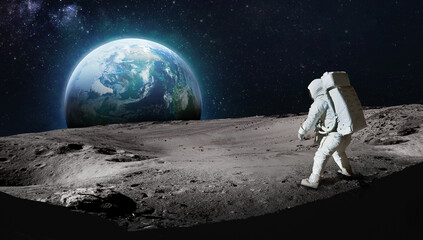 Wall Mural - astronaut on surface of the moon. earth on background. apollo space program. exploration of moon. da