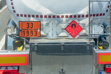 rear view of a tank truck transporting highly flammable dangerous goods.