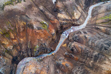 Aerial View Of A Stream Through A Canyon In The Colorful Kerlingarfjoll Mountains In The Highlands Of Iceland