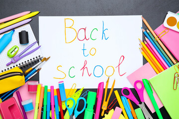 Wall Mural - Different school supplies with text Back to School on black background