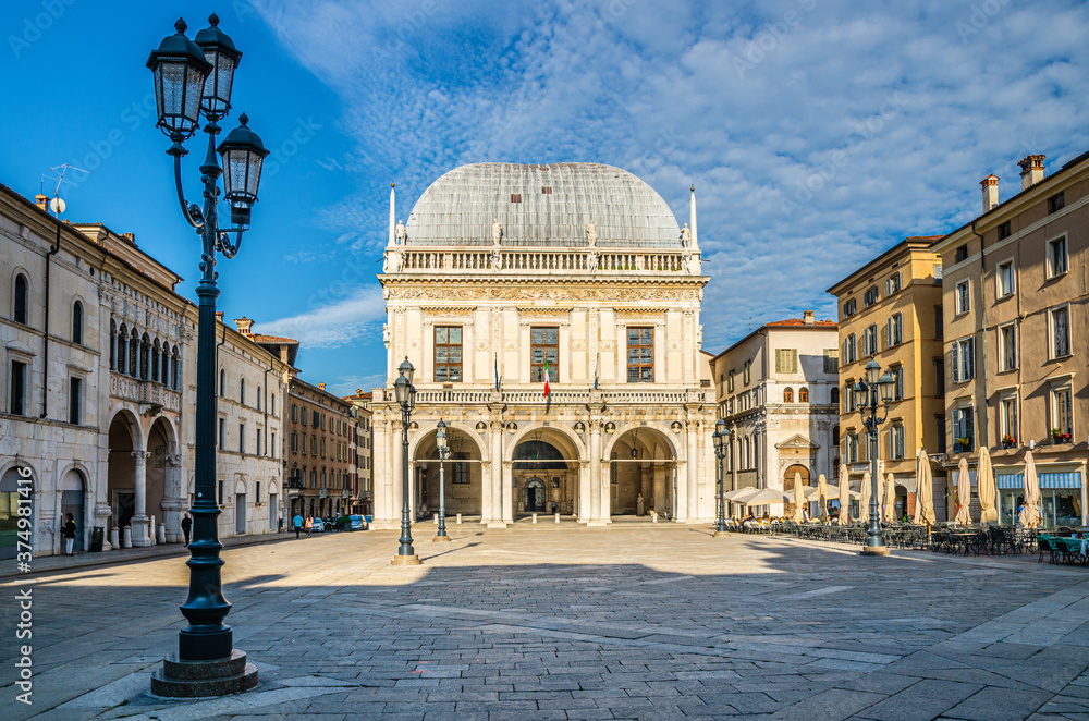 Palazzo della Loggia palace Town Hall Renaissance style building and street lights in Piazza della Loggia Square, Brescia city historical centre, blue sky background, Lombardy, Northern Italy - obrazy, fototapety, plakaty 