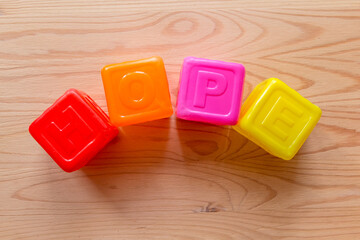 Hope word made of children plastic cubes