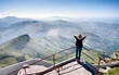 © Ivan Bastien photographe/Stocksy - Young woman gazing at Pyrenees Mountains