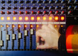 © kkgas/Stocksy - Hand operating mixing desk motion blur
