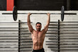 © Guille Faingold/Stocksy - Man lifts weights In a gym