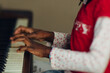 © Gabriel (Gabi) Bucataru/Stocksy - Hands of a black girl playing the piano