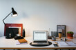 © BONNINSTUDIO/Stocksy - Laptop on table in home office