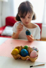 Little Girl Decorating Easter Eggs