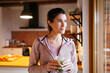 © BONNINSTUDIO/Stocksy - Adult woman drinking an smoothie at home.