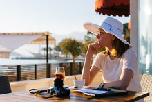 Woman In Cafe By The Sea