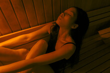 Asian Woman Relaxing In Infrared Sauna