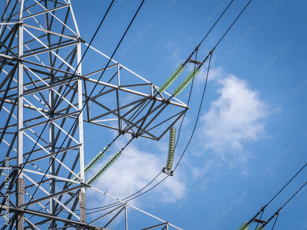 Support of high-voltage power line. Glass electrical insulators on pole ...