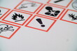 © Canaan - WHMIS 2015 SYMBOLS WORKPLACE HAZARDOUS MATERIAL INFORMATION SYSTEM. SKULL AND CROSSBONE MAIN FOCUS. FLAME, SYMBOLS ON PAPER. POISONOUS SYMBOL FOR INDICATORS AND FOR EMPLOYEE AND EMPLOYER