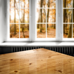 Desk of free space and autumn window 