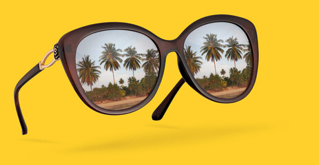 Wall Mural - Retro sunglasses with reflection of palms isolated