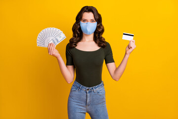 Sticker - Portrait of her she attractive wavy-haired girl wear safety reusable mask holding hand bank card fan cash mers cov prevention insurance isolated bright vivid shine vibrant yellow color background