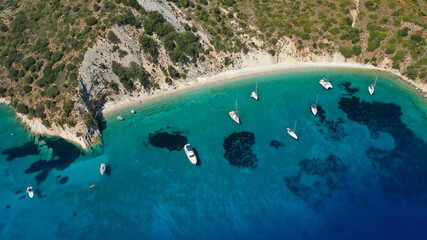 Aerial drone photo of turquoise paradise sandy beach and bay of Filatro a safe sail boat anchorage in Ithaki or Ithaca island, Ionian, Greece