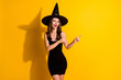 © deagreez - Portrait of her she nice attractive pretty glad elegant cheerful cheery lady wizard demonstrating copy space advice advert isolated over bright vivid shine vibrant yellow color background