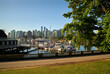 © maxdigi - Coal Harbor Walkway Vancouver. The Vancouver skyline from the Stanley Park shoreline across Coal Harbor. British Columbia, Canada.