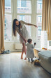 © simon/Stocksy - Mother playing with her little girl at home