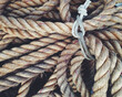 © Greg Schmigel/Stocksy - Heavy brown rope tied in a bundle