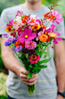 © Suzi Marshall/Stocksy - Man holding a bunch of flowers