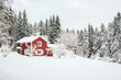© Stephen W. Morris Photography/Stocksy - Red Cottage in Snowy Swedish Landscape