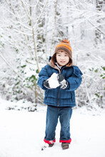 Asian Boy Playing Snow In The Winter