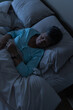 © SKC/Stocksy - Sleeping in Bed at Night