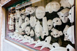 © Jen Grantham Photography/Stocksy - Classic Venetian masquerade masks in shop window.